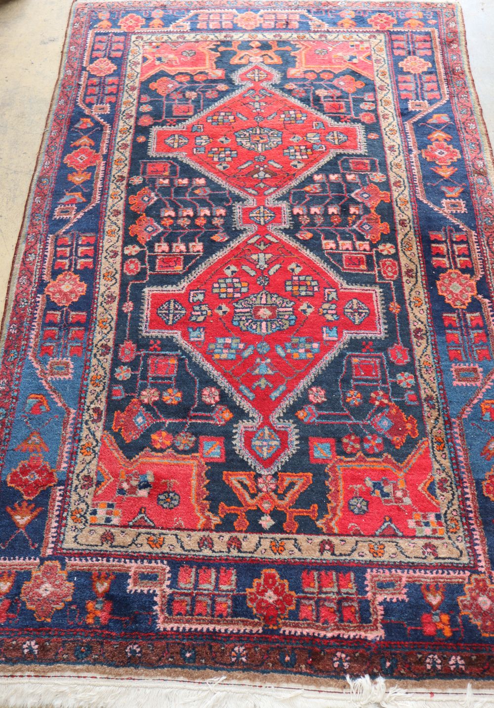 A Kurdish bue ground rug, approx. 240 x 144cm